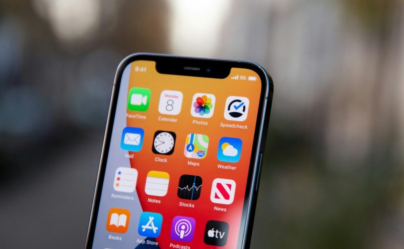 black iphone 5 on white textile