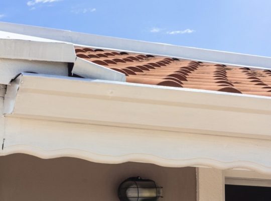a close up of a roof with a sky background