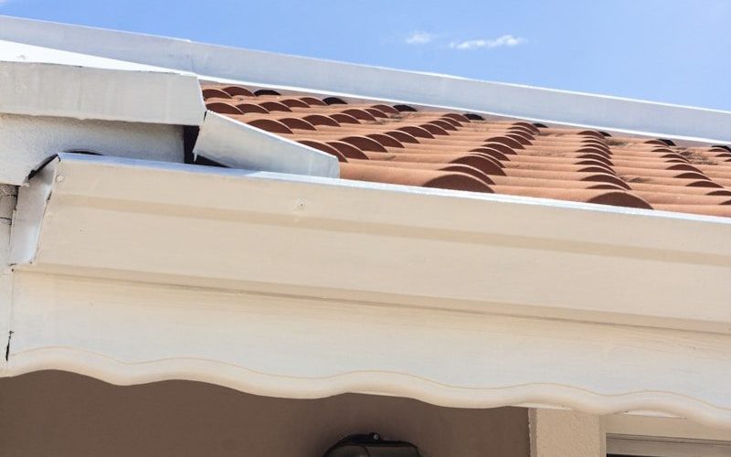 a close up of a roof with a sky background