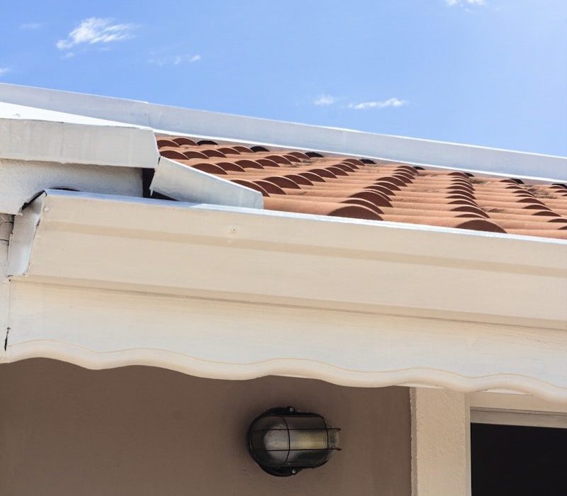 a close up of a roof with a sky background